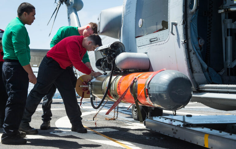 Pacific Ocean (April 20,2018) Aviation maintainers assigned to Helicopter Maritime Strike Squadron (HSM) 71  secure a Mark 46 lightweight torpedo (MK-46) to an MH-60R helicopter aboard USS Stockdale (DDG 106) prior to an anti-submarine event during a Cruiser-Destroyer  (CRUDES) Surface Warfare Advanced Tactical Training (SWATT) exercise.  Stockdale is one of three CRUDES warships from USS John C. Stennis (CVN 74) Carrier Strike Group (CSG) completing a CRUDES SWATT exercise.  The other ships participating in the Naval Surface and Mine Warfighting Development Center (SMWDC) led exercise are USS Mobile Bay (CG 53) and USS Spruance (DDG 111).  SWATT exercises are designed to increase warfighting proficiency, lethality, and interoperability of participating units. (U.S. Navy photo by Mass Communication Specialist 2nd Class Amanda A. Hayes/released)